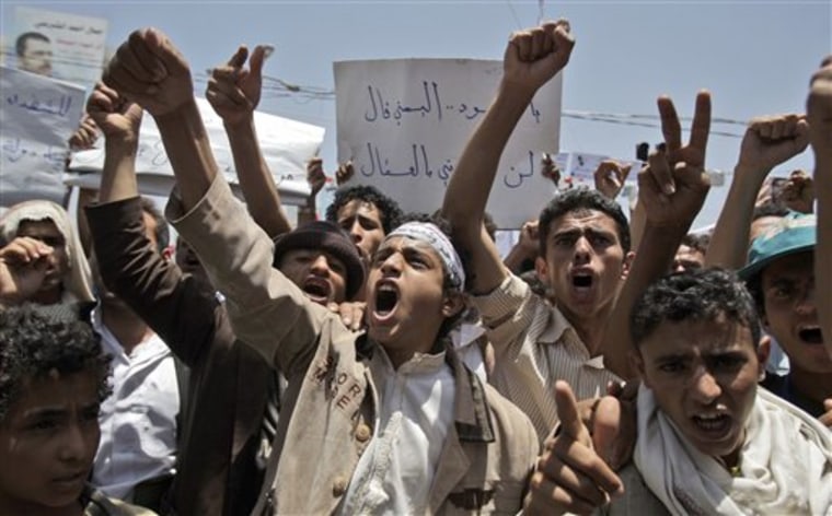 Anti-government protesters shout slogans during a demonstration demanding the resignation of Yemeni President Ali Abdullah Saleh, in Sanaa, Yemen, on Saturday.